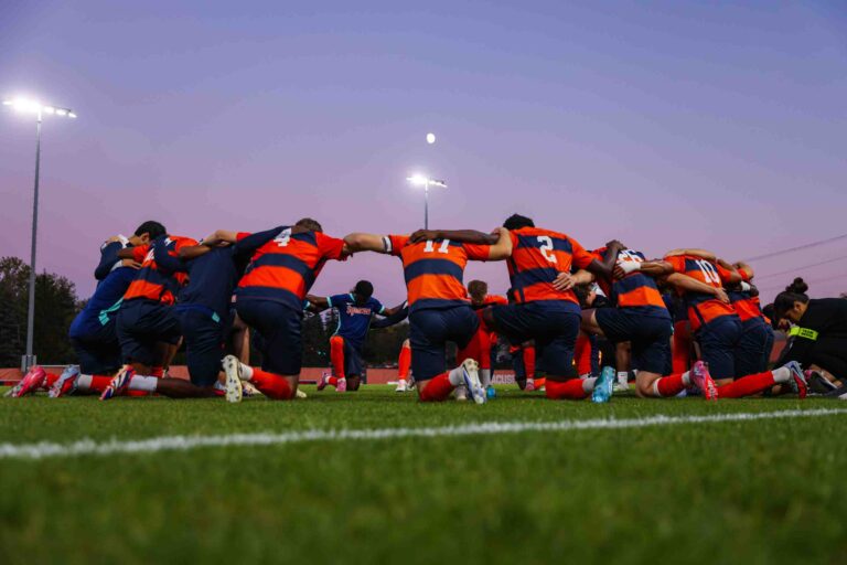 The Syracuse University Men's Soccer team faced off against Boston College on Friday, October, 3, 2025. The team came together before the game in prayer.