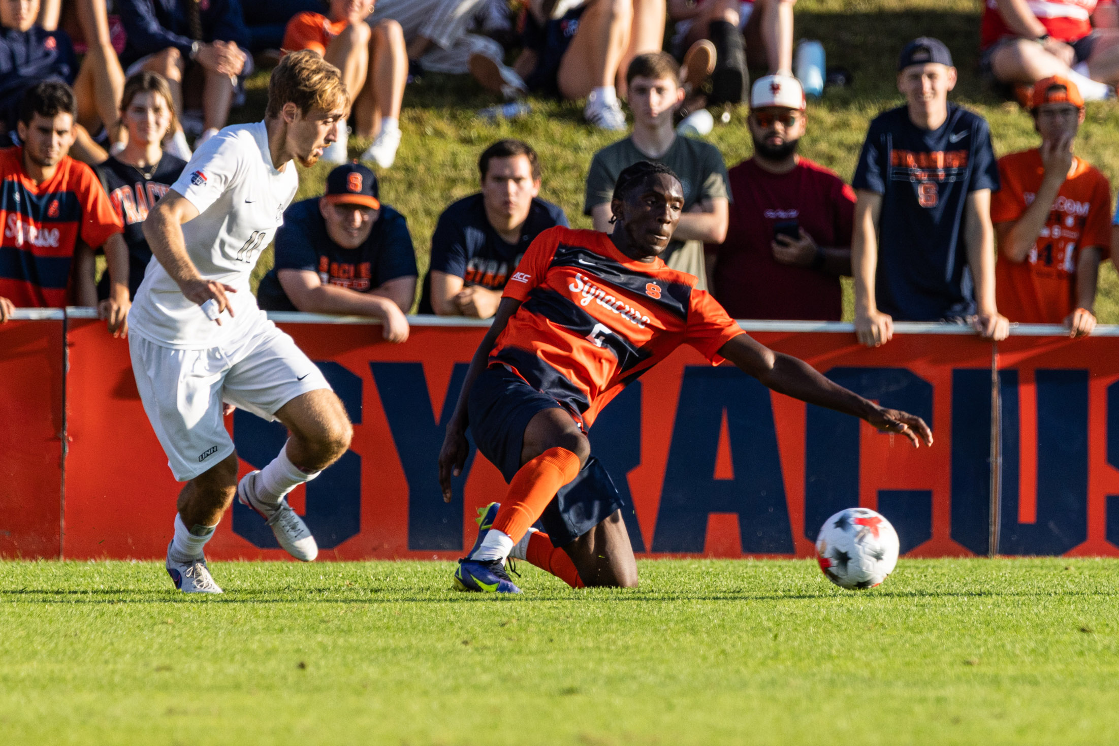 SU defender Chimere Omeze slides for the ball in front of his goal during Syracuse University men’s soccer team faced off against the University of New Hampshire on Sunday, August, 23, 2026.