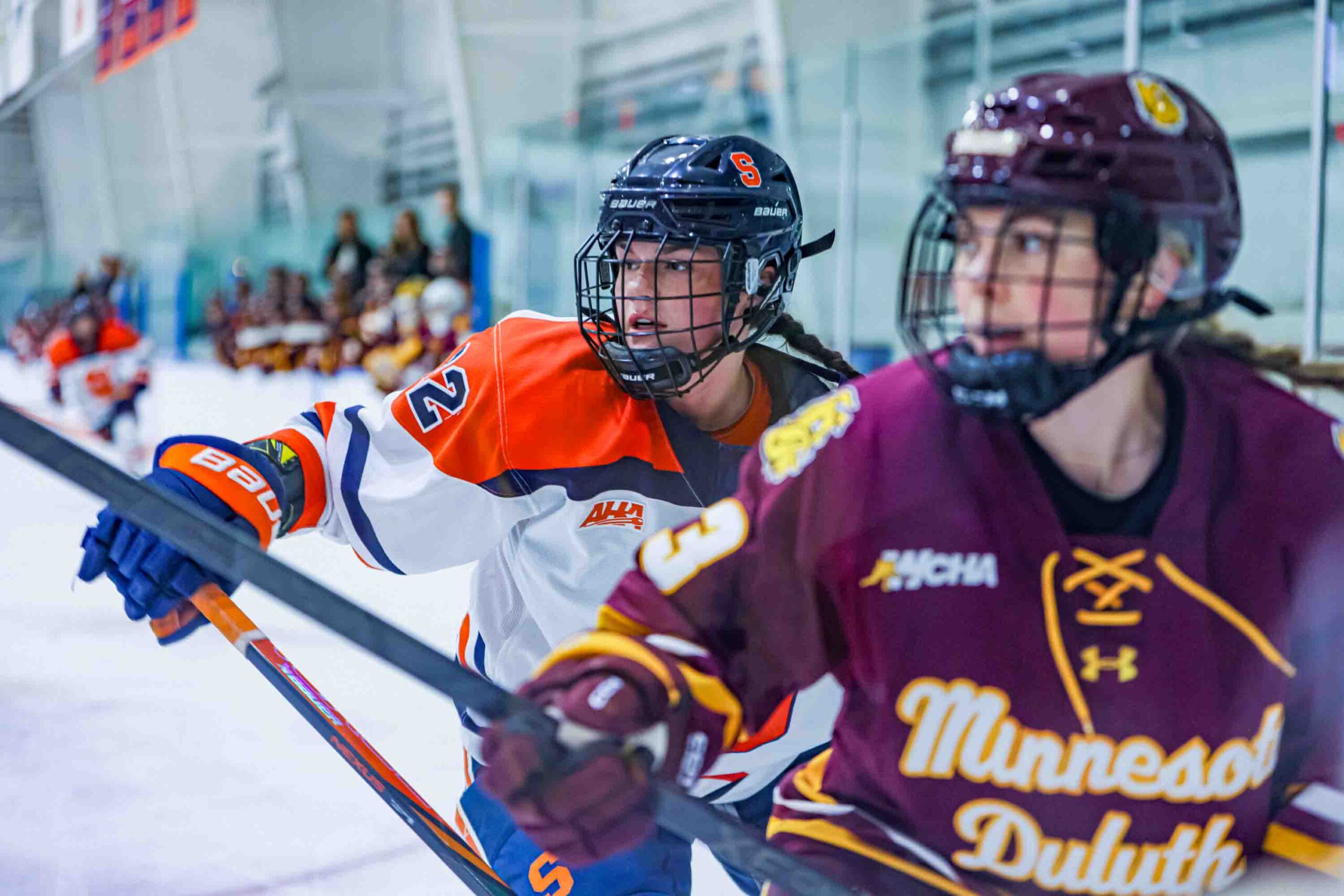 The Syracuse University Women's Hockey team faced off against the University of Minnesota Deluth on Friday, September, 26, 2025. Senior Charlotte Hallett battled in the corner in the first period of the game.