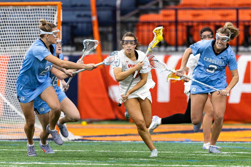 The Syracuse University Women's Lacrosse team faced off against the University of North Carolina on Friday, February, 13, 2026. Defender Coco Vandiver escaped pressure in front of her net.