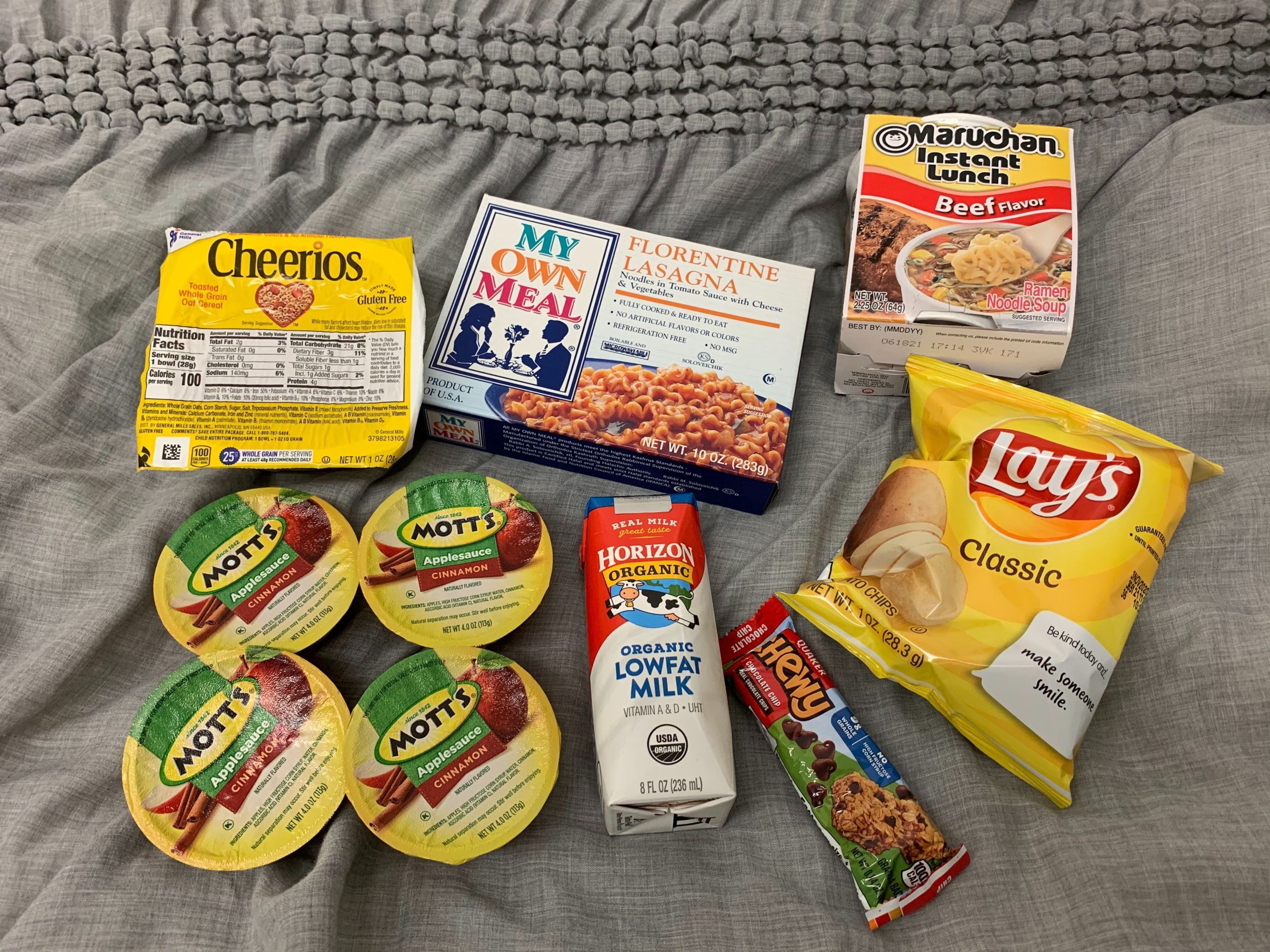 Meal provided to students including; Lays; ramen; apple sauce; milk; a granola bar; and a microwavable meal