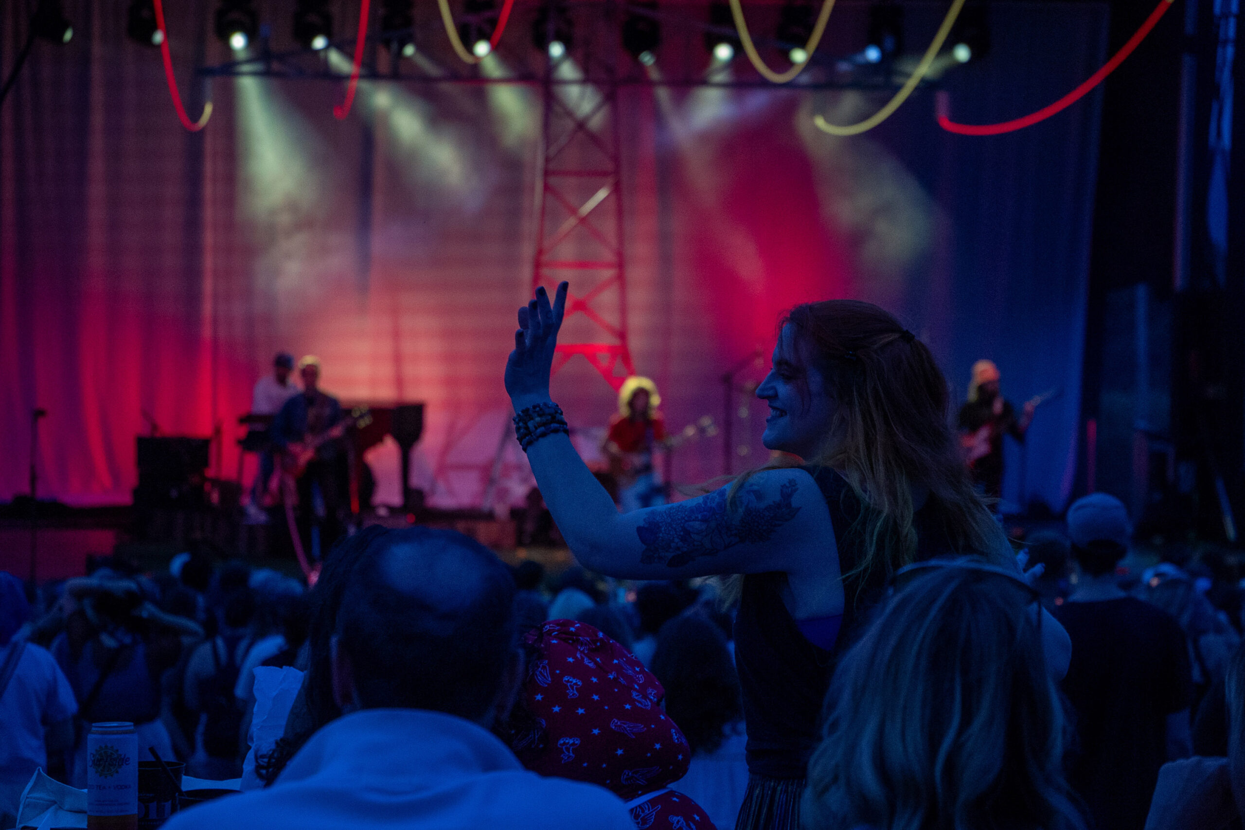 A fan dances to Jesse Welles during his show at Beak and Skiff Apple Orchards on Saturday, August 1, 2026.