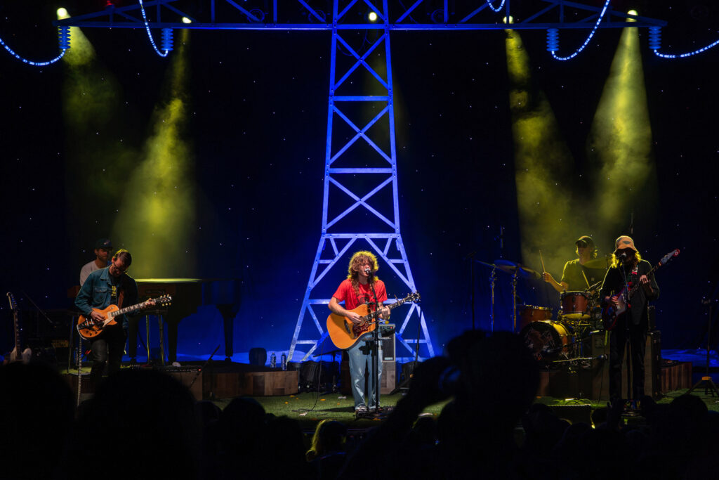 Jesse Welles' stage includes a tower of power lines that pay tribute to his early social media videos at Beak and Skiff Apple Orchards on Saturday, August 1, 2026.