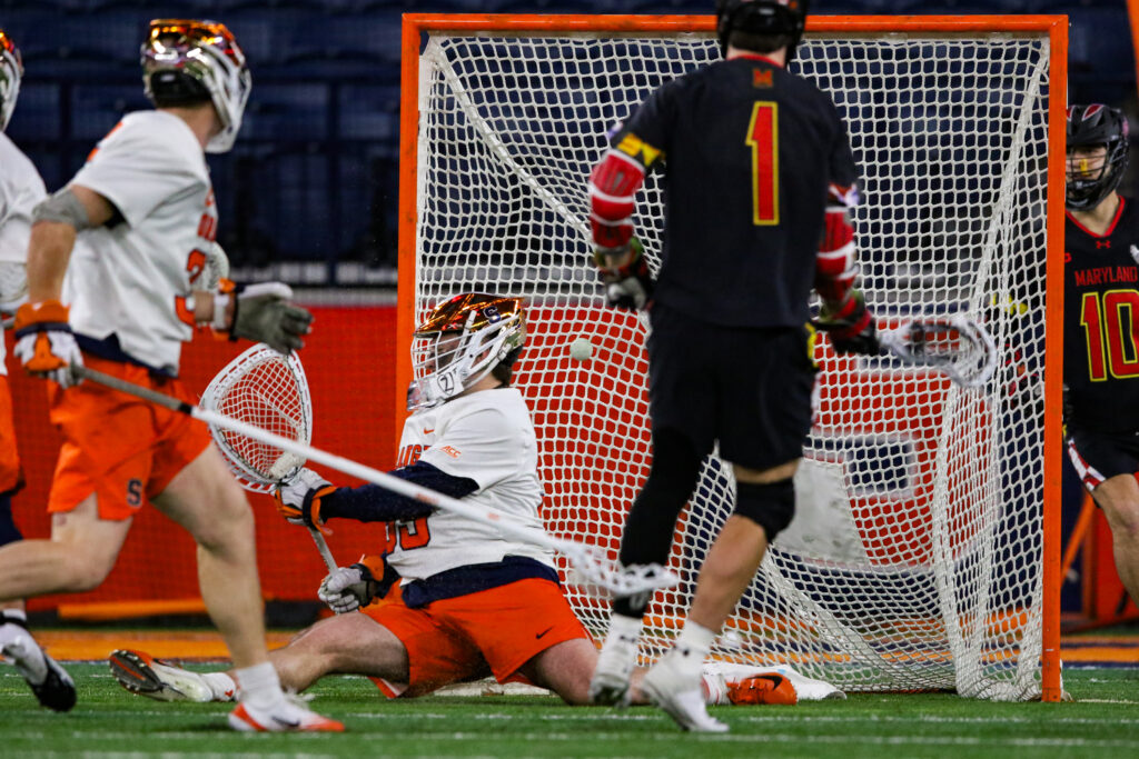 Syracuse goalie Jimmy McCool allows a Maryland goal at the JMA Wireless Dome on Friday, Feb. 13.