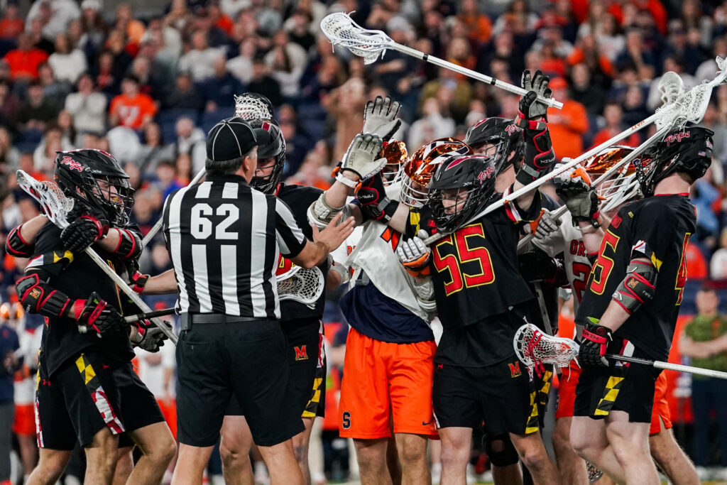 Syracuse defender Riley Figueiras gets caught up with Maryland attacker Matt Higgins almost sparking a fight at the JMA Wireless Dome on Friday, Feb. 13.
