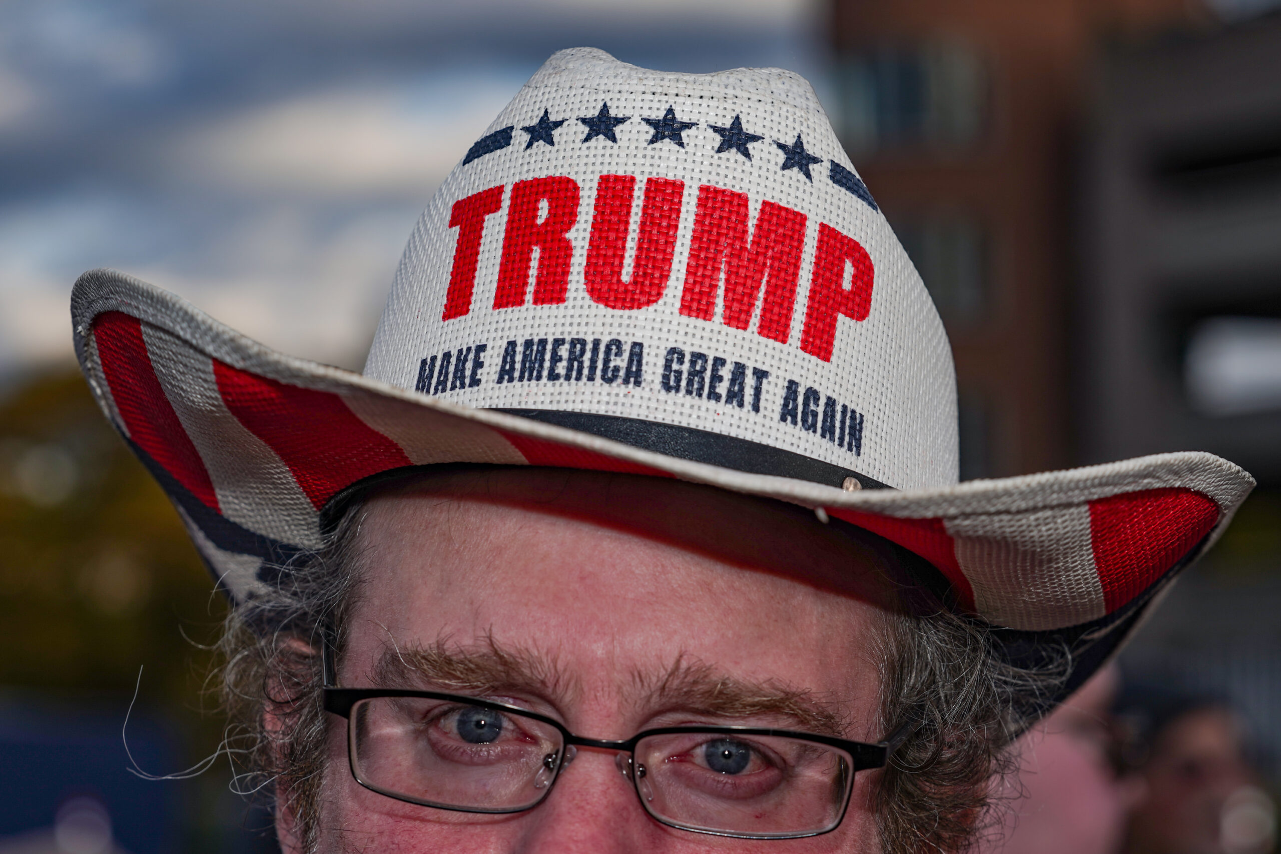 Joe McNally of Syracuse, NY, wears a Trump branded cowboy hat outside of the Trump rally at the Oncenter on Friday, Oct. 9, 2026.