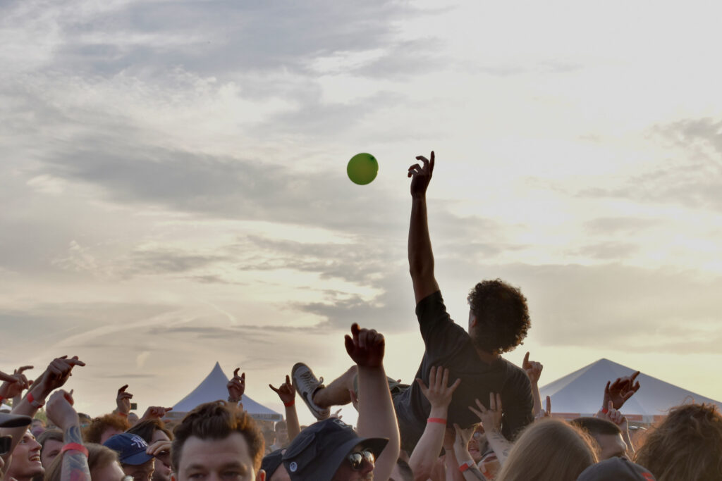 Crowd surfer putting arm up during sunset at Beak & Skiff Apple Orchards in LaFayette on Friday, June 5, 2026.
