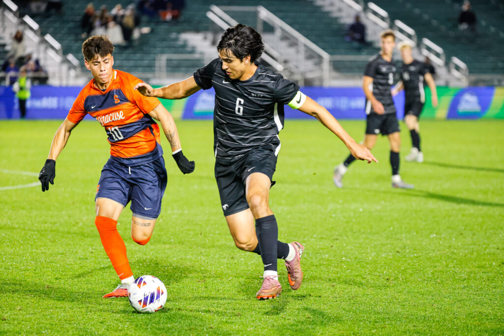 Carlos Zambrano battles an SMU player for the ball.