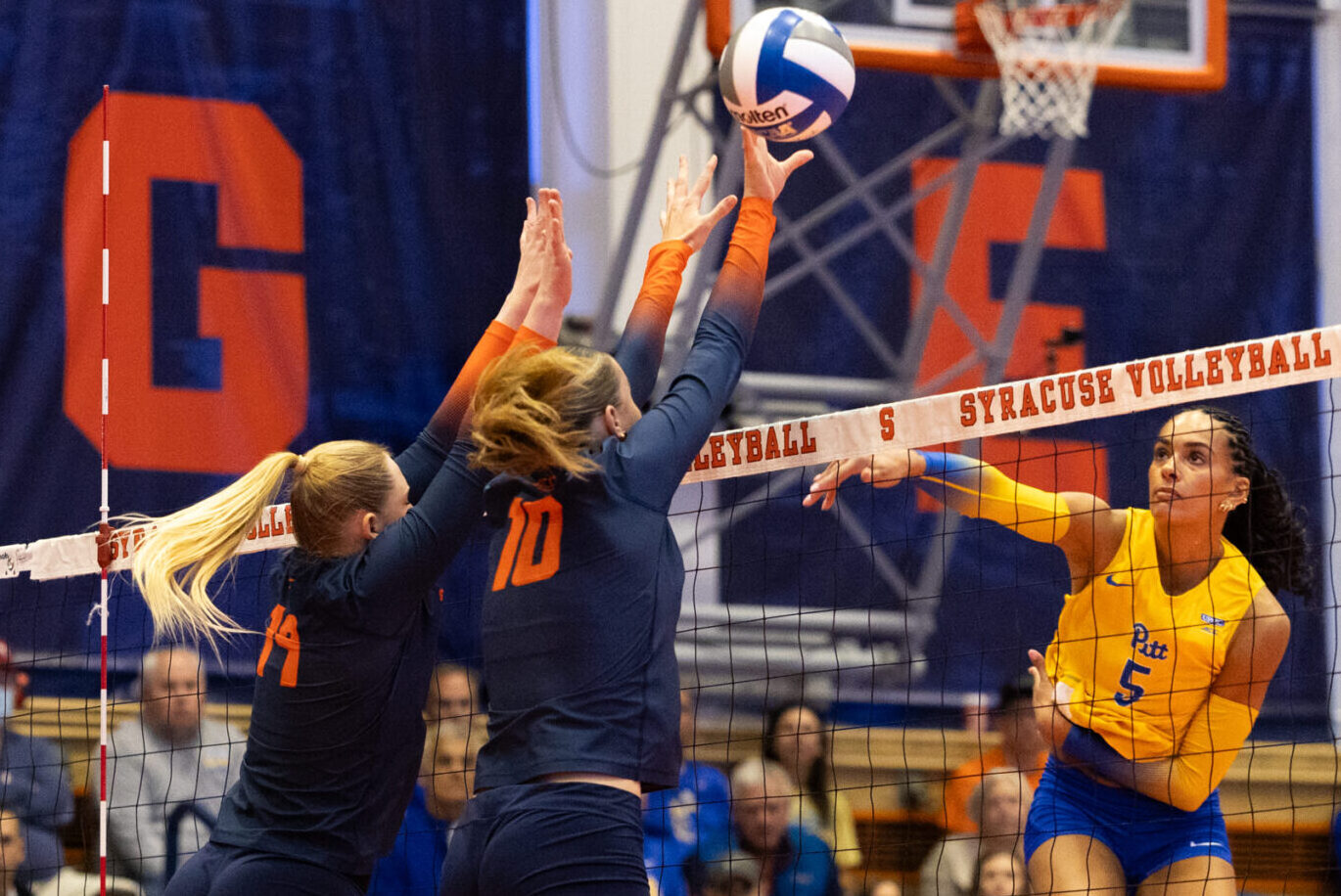 Syracuse players Emma Williams and Bo Nijenhuis jump to block Pitt at the Women's Building on Oct. 4, 2026