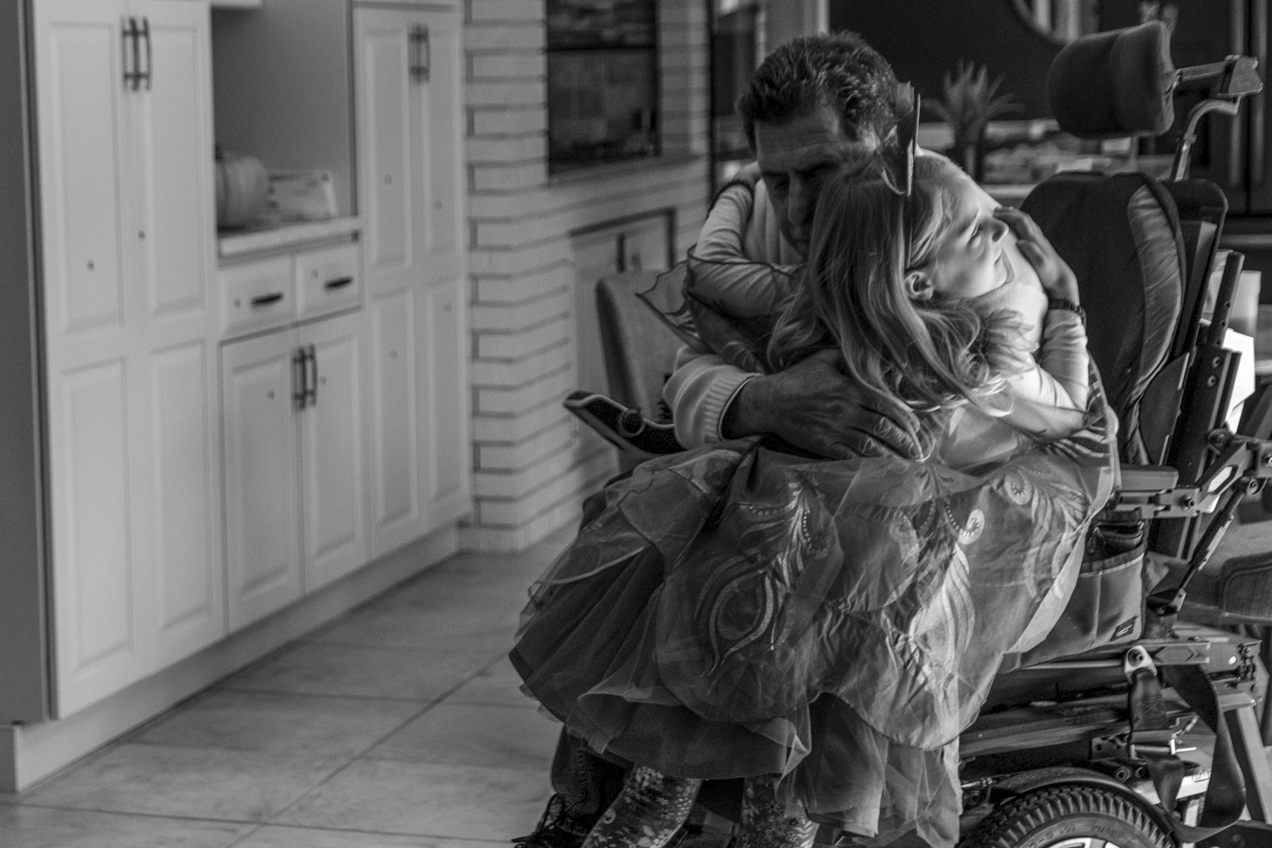 October 18th, 2020. Joseph Pagano's granddaughter hugs him after tiring herself out being a peacock and showing off her feathers.