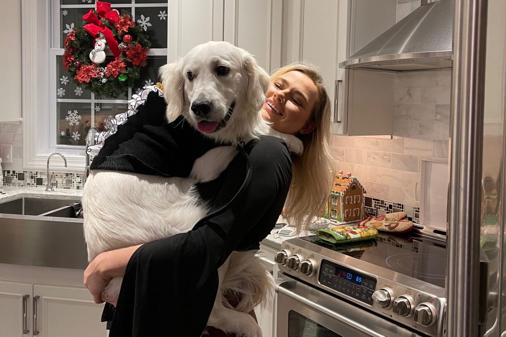 SU sophomore Mandy Good holds her dog, Bentley, who she adopted in May 2020.