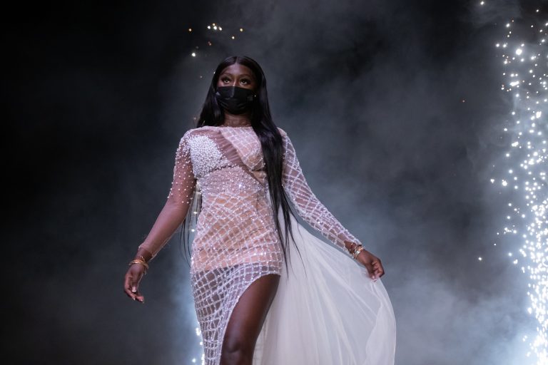 A student model walks the runway at the Syracuse University African Student Union Fashion Show.