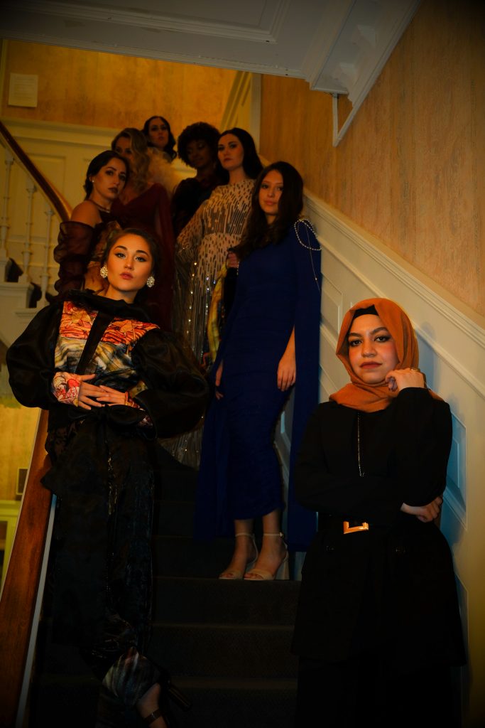 Kal and her models pose for a portrait during the second event of Syracuse Fashion Week.