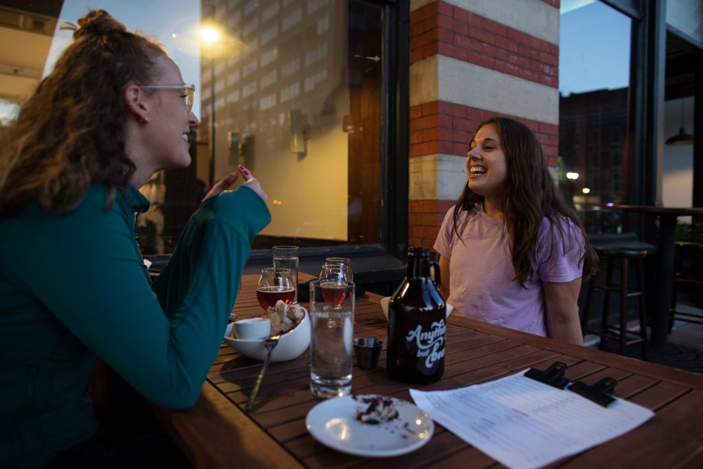 Natalie Wiesnet Shelton (Left) and Jessica Jarett (Right) enjoy a drink and a meal at Anything But Beer on September 10th, 2021. (Photo by Ryan Griffith)