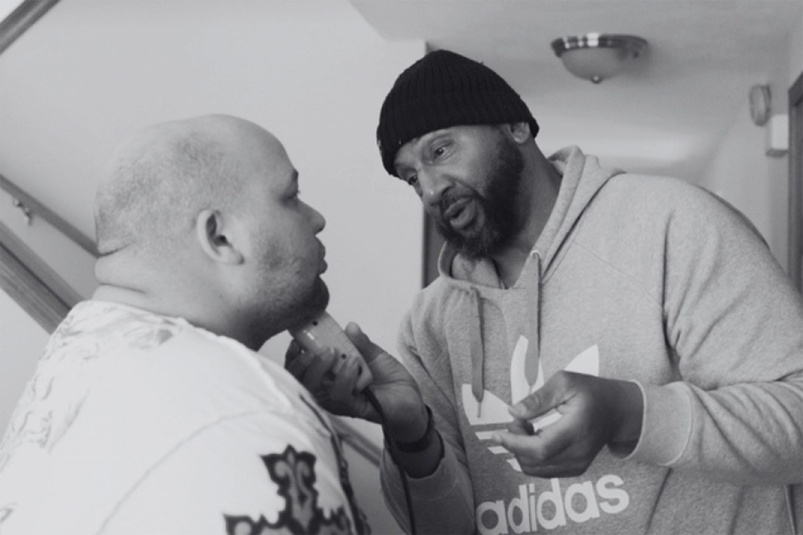 Damon Gilstrap helps his son Jabril shave as part of the documentayr "I Belong Here."