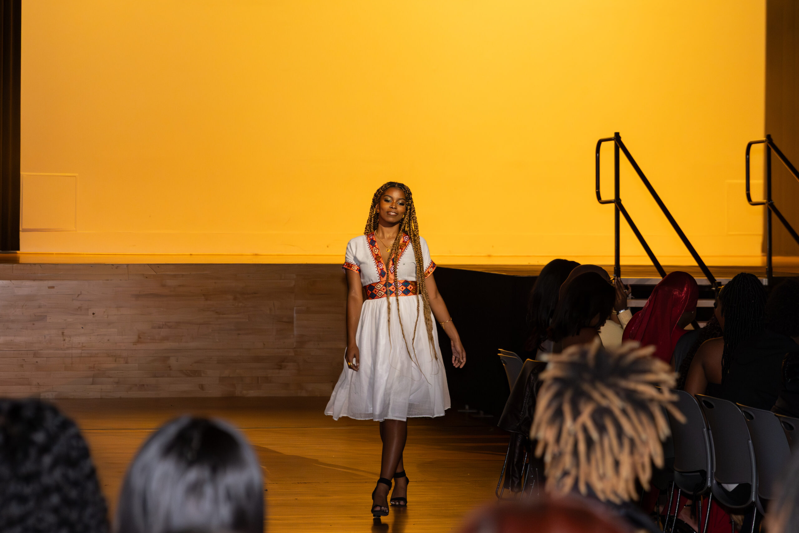 Models showcase designer Neo Habisha’s pieces in Goldstein Auditorium as part of Rip the Runway on November 2, 2025. The event was hosted by Syracuse’s African Student Union and the Fashion and Design Society and represented three designers’ work.