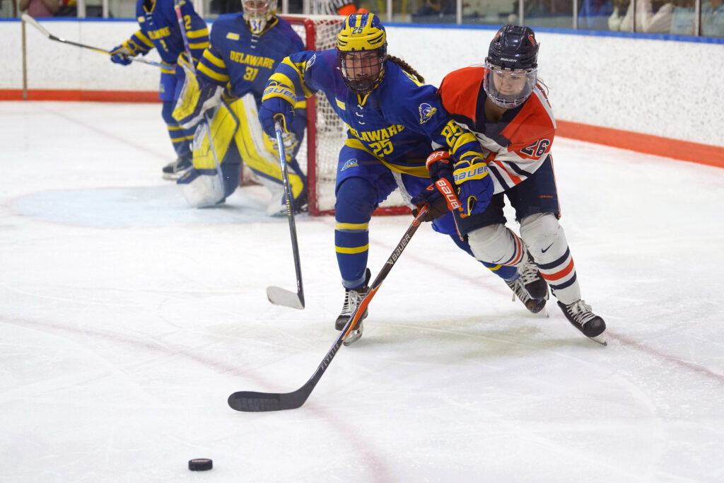 Syracuse forward Peyton Armstrong (26) races a Delaware player to the puck on Thursday, Oct. 29, 2026, at Tennity Ice Pavilion.