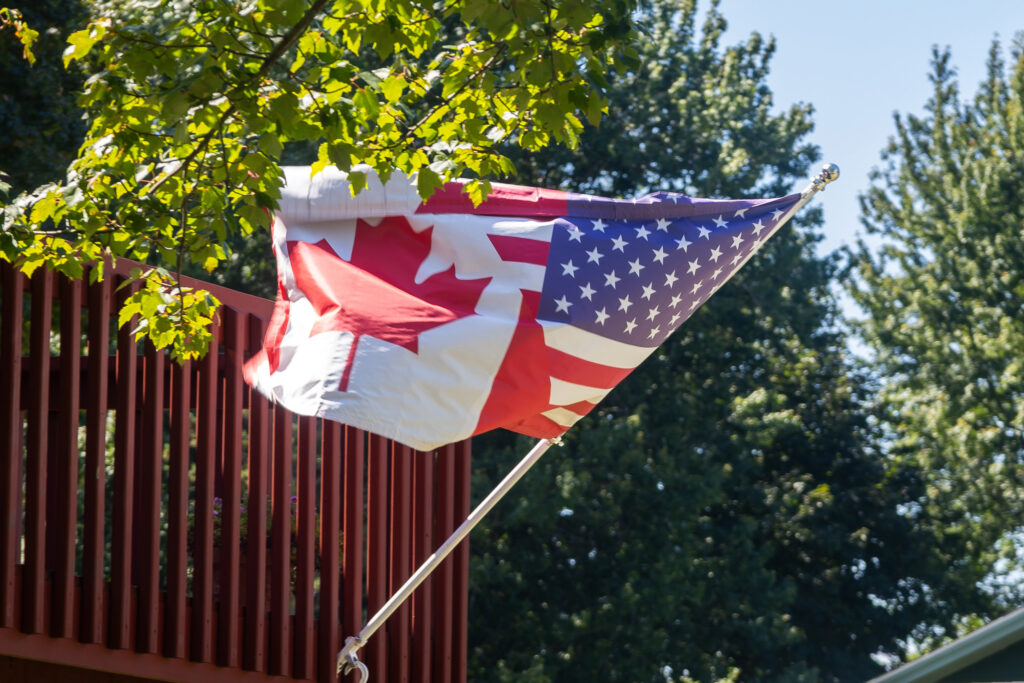 A flag split evenly between the U.S. and Canadian flags waves in Oswego, New York, on Aug. 30, 2026