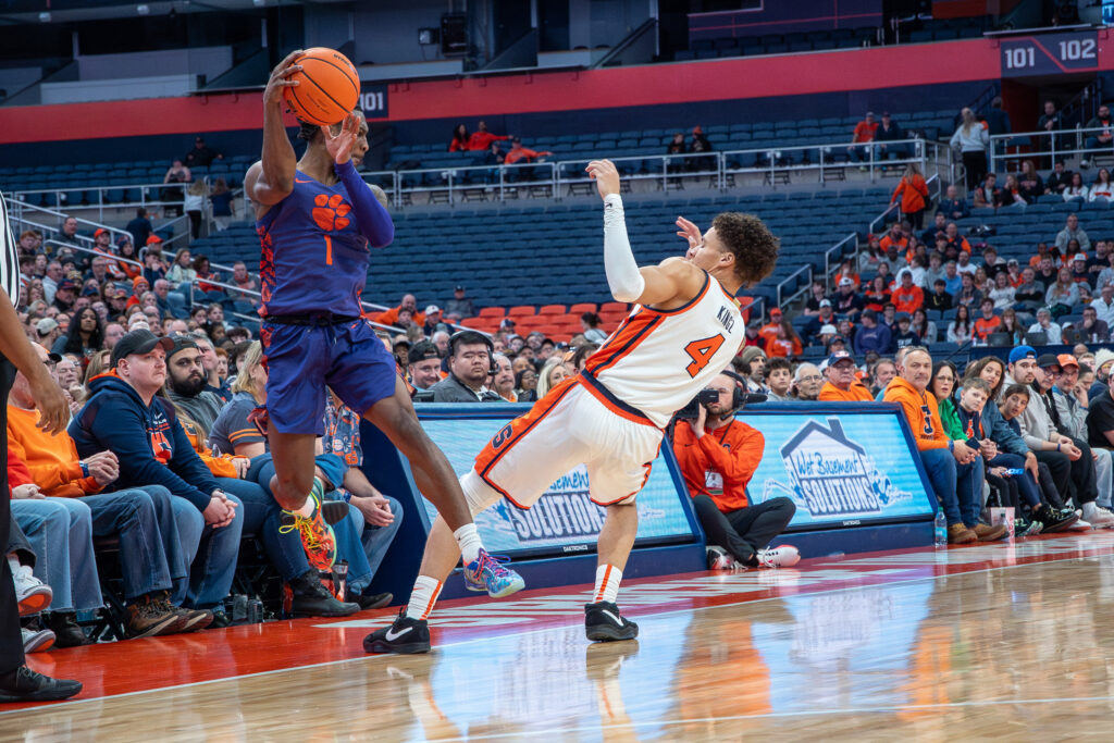 Clemson guard Jestin Porter tries to bounce the ball off of Syracuse guard Nate Kingz to keep possession on Wednesday, Dec. 31, 2025, at the JMA Wireless Dome.