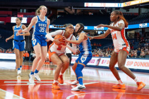 Syracuse guard Laila Phelia protects the ball against Duke guard Taina Mair in the paint on Sunday, Dec. 28, 2025, at the JMA Wireless Dome.