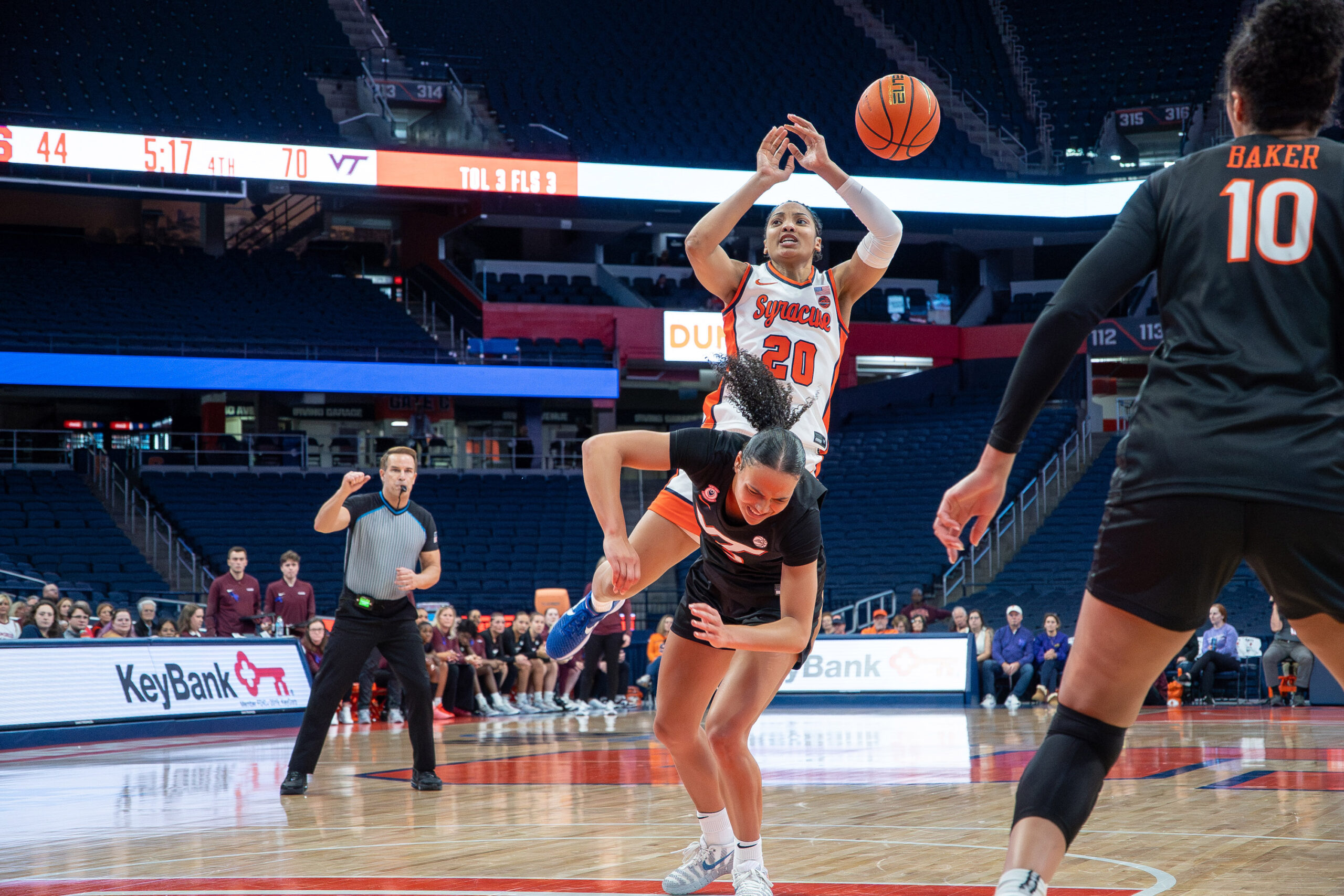 Syracuse guard Dominique Darius draws contact against Virginia Tech guard Mackenzie Nelson on at the JMA Wireless Dome on Thursday, Jan. 8, 2026.