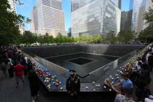 Visitors gather at the reflecting pools on the 25th anniversary of the September 11th terrorist attacks on the World Trade Center at the National 9/11 Memorial & Museum on September 11, 2026, in New York City. The United States is marking the 25th anniversary of the terrorist attacks of September 11, 2001, when a group of al-Qaeda hijackers flew airplanes into the World Trade Center, Shanksville, Pennsylvania, and the Pentagon, killing nearly 3,000 people.