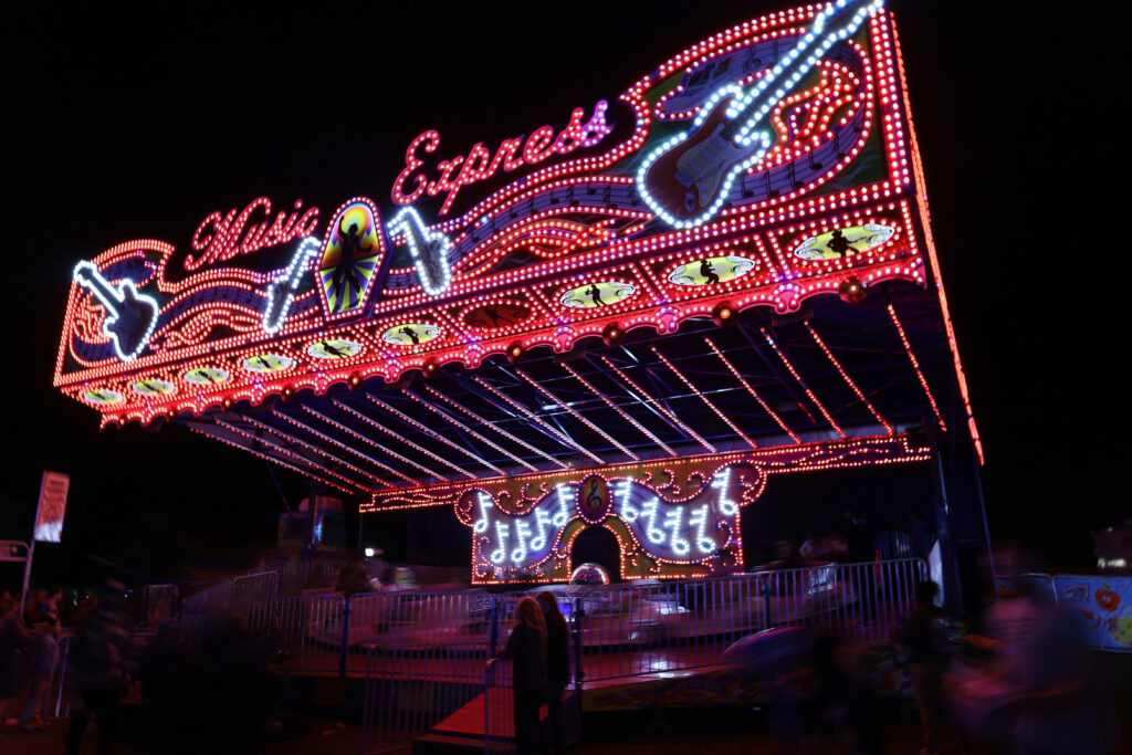 The music express roller coaster, lights outlining shapes of guitars and saxophones in the dark, at the 2025 New York State Fair on Sunday, August 31, 2025.
