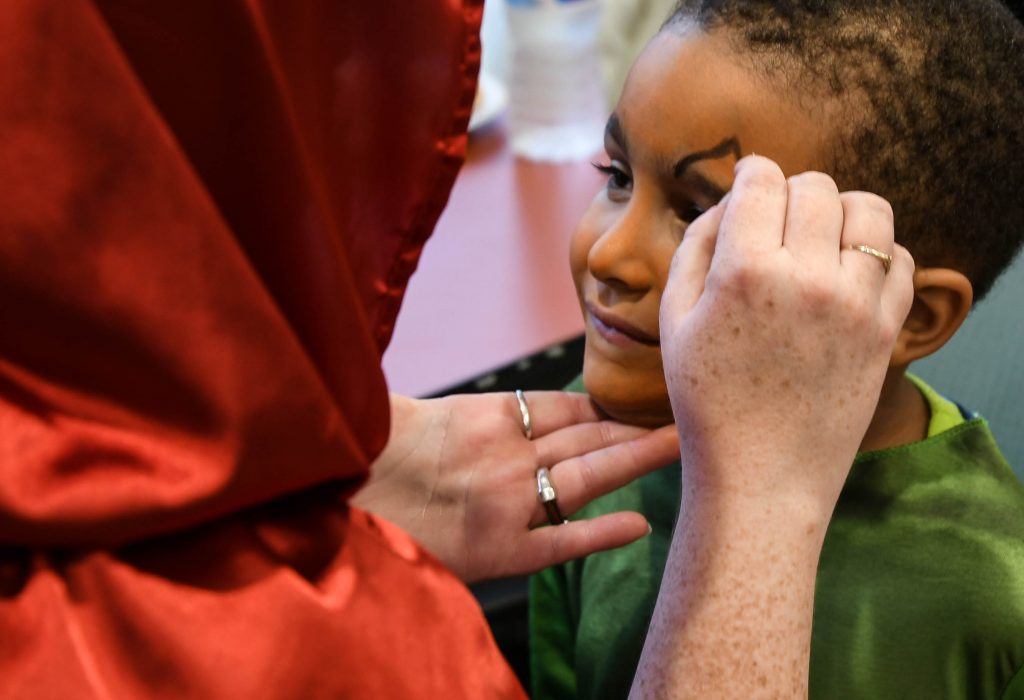 Emery Battle, 4, gets his face painted.