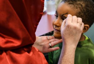 Emery Battle, 4, gets his face painted.