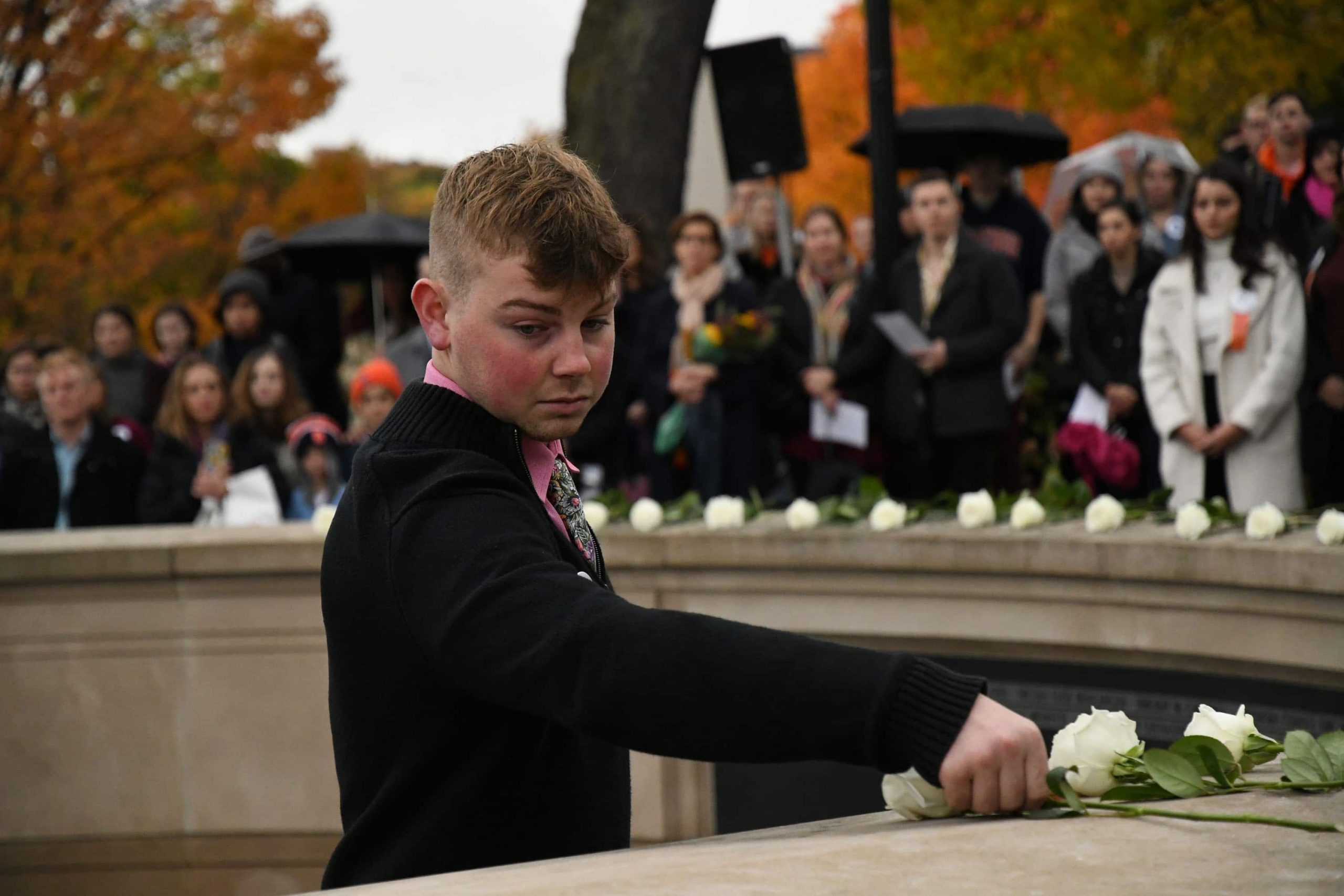 Lockerbie scholar Brodi Chambers places a rose during Friday's tribute services Syracuse students lost in Pan Am Flight 103.