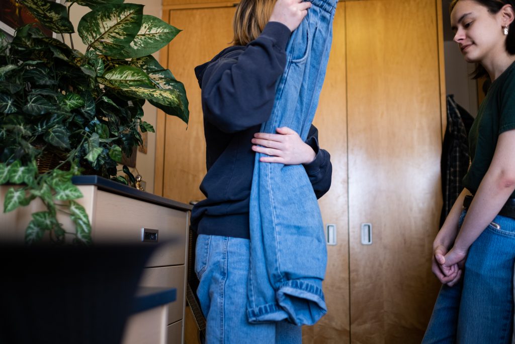 Lilly Chidlaw-Mayen hangs out while Emily Burris packs a bag to go back to Florida.