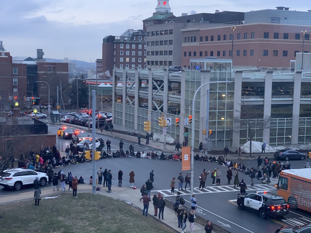 NotAgainSU protestors blocked cars and buses along Waverly Avenue late Wednesday afternoon.