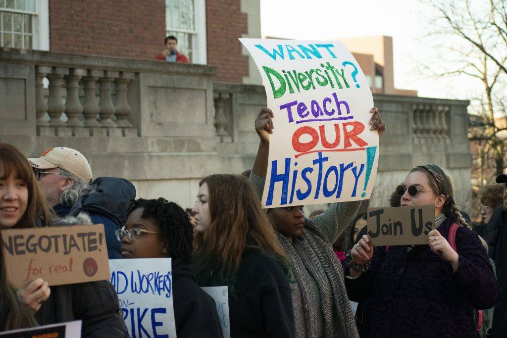 Syracuse University faculty members and students marched across campus to show solidarity with #NotAgainSU protestors on March 5, 2020.