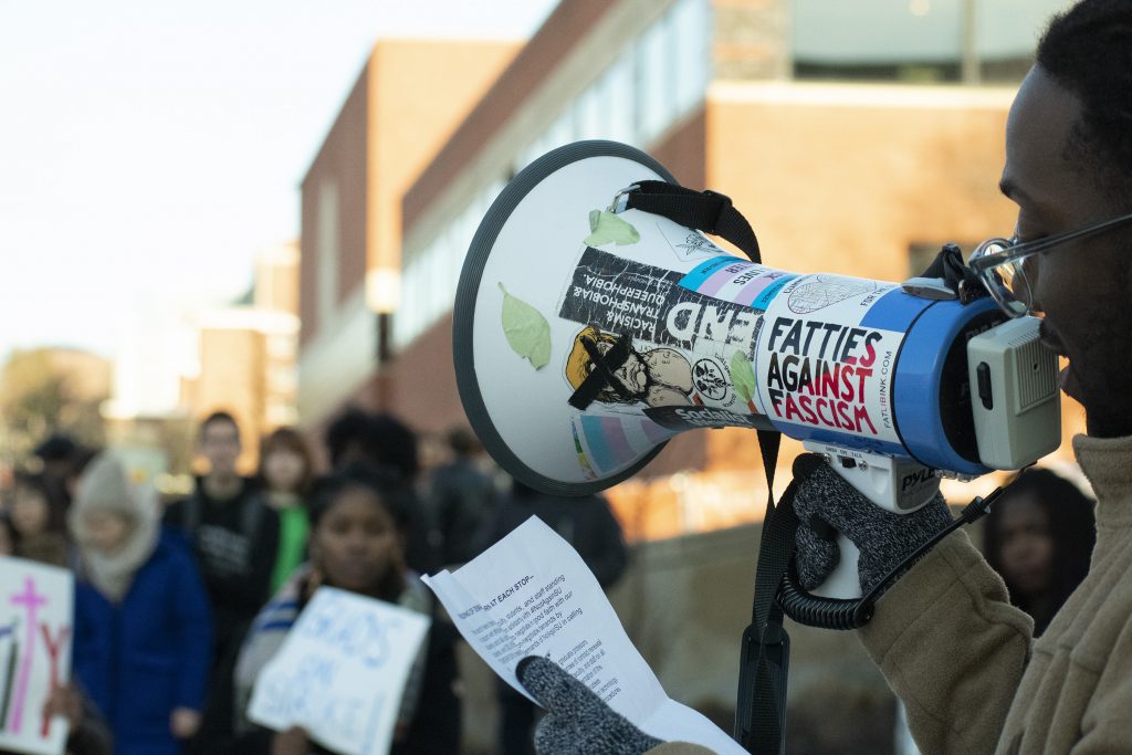 Syracuse University faculty members and students marched across campus to show solidarity with #NotAgainSU protestors on March 5, 2020.