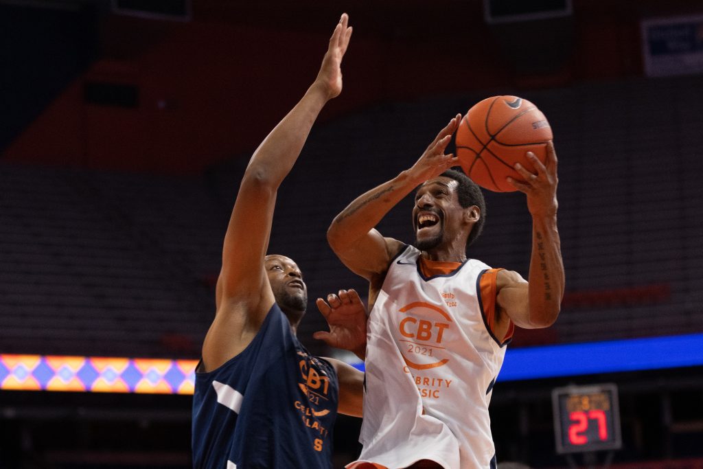 Lawrence Moten, right, eyes the hoop as he goes up for two points with John Wallace defending the paint.