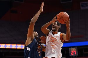 Lawrence Moten, right, eyes the hoop as he goes up for two points with John Wallace defending the paint.