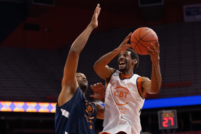 Lawrence Moten, right, eyes the hoop as he goes up for two points with John Wallace defending the paint.