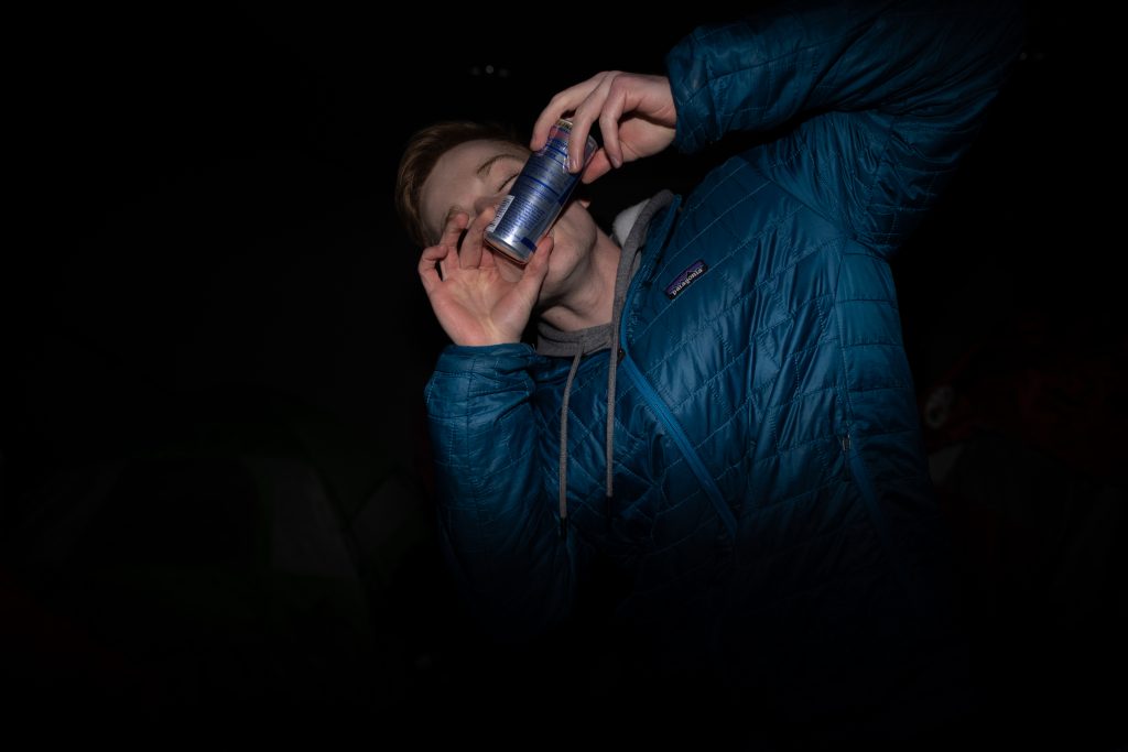 SU student, Eric Silfies, shotguns a RedBull in Boeheimburg on Thursday night.