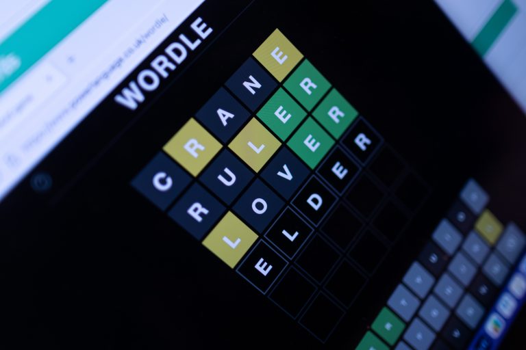 A photograph of the game Wordle is taken from an above angle.