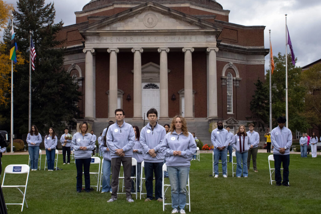 Scholars take their places by the chairs representing each Syracuse University student on PanAm flight 103