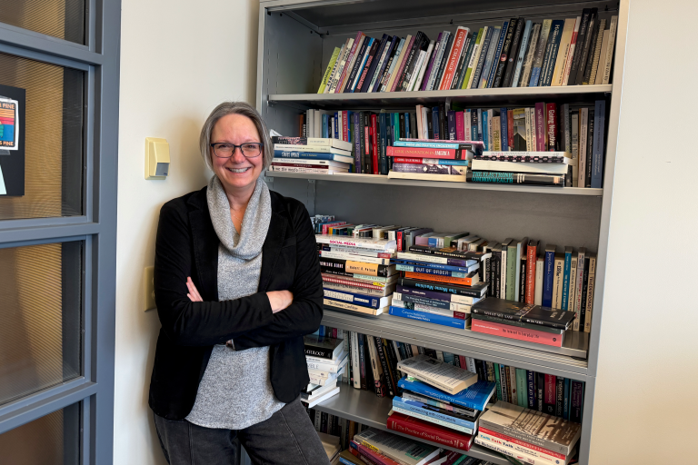 Jennifer Stromer-Galley in front of a book shelf.