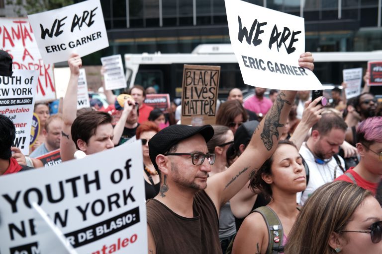 People participate in a protest to mark the five year anniversary of the death of Eric Garner during a confrontation with a police officer in the borough of Staten Island on July 17, 2019 in New York City. Yesterday it was announced that federal prosecutors will not charge New York City Police Officer Daniel Pantaleo in the death of Garner, who repeated the phrase "I can't breathe" almost a dozen times while being arrested for an alleged misdemeanor.