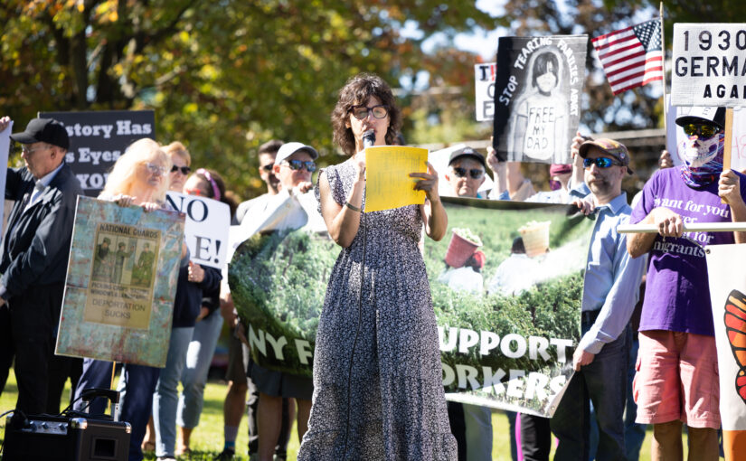 Erin Fiorini starts the gathering at Voorhees Park in Fulton. The event advocated for workers detained from the Nutrition Bars Confectioners facility in Cato earlier this month.