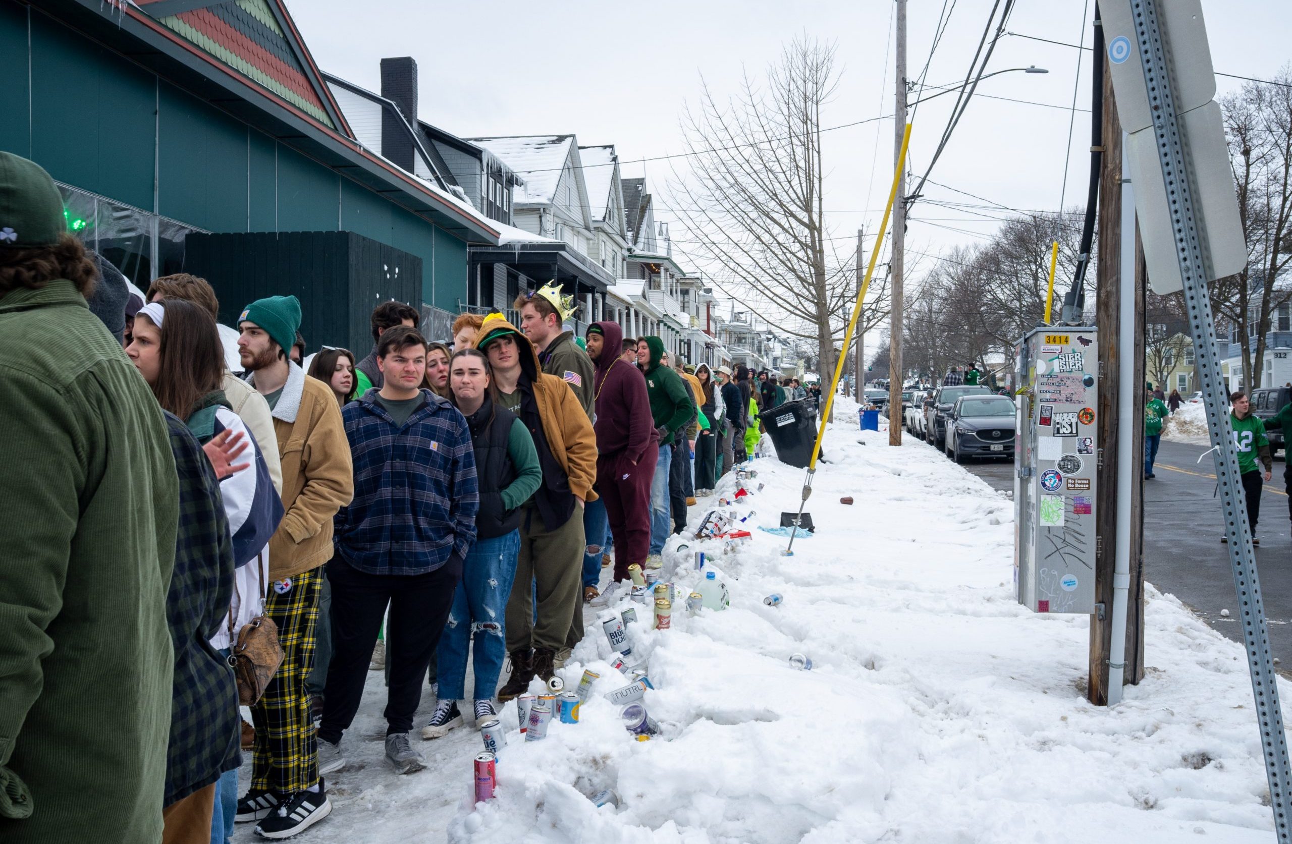 Thousands of students and Syracuse residents line up outside of Coleman's Authentic Irish Pub in the Tipperary Hill neighborhood for the famous Green Beer Sunday festivities on Sunday.