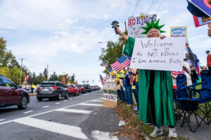 A protestor dressed as the Statue of Liberty at the No Kings protest along Erie Boulevard in Syracuse on Saturday, Oct. 18, 2025. A wide variety of costumes could be seen throughout the protest.
