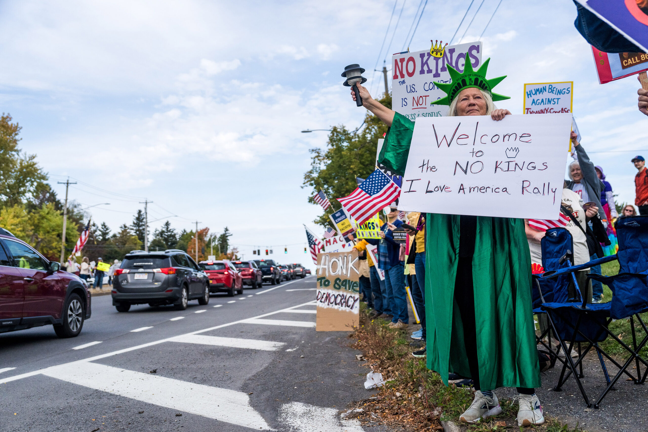 A protestor dressed as the Statue of Liberty at the No Kings protest along Erie Boulevard in Syracuse on Saturday, Oct. 18, 2025. A wide variety of costumes could be seen throughout the protest.