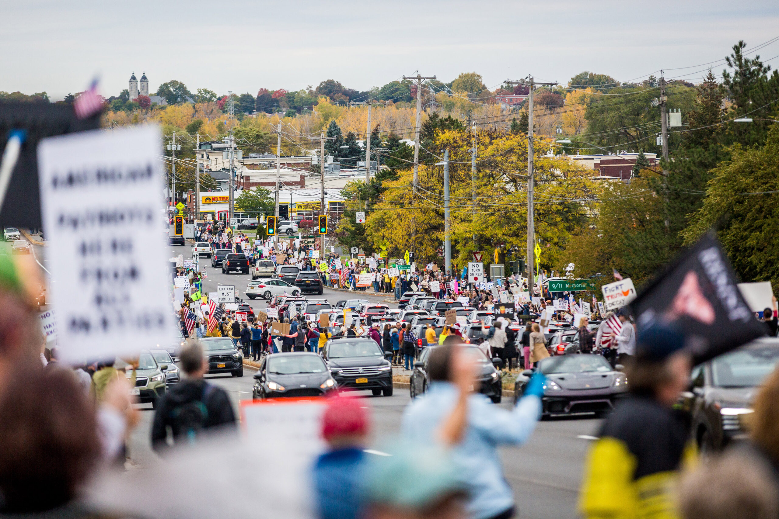 No Kings protesters line Erie Boulevard in Syracuse on Saturday, Oct. 18, 2025. They stretched about a mile down the street starting at E Genesee ST E.