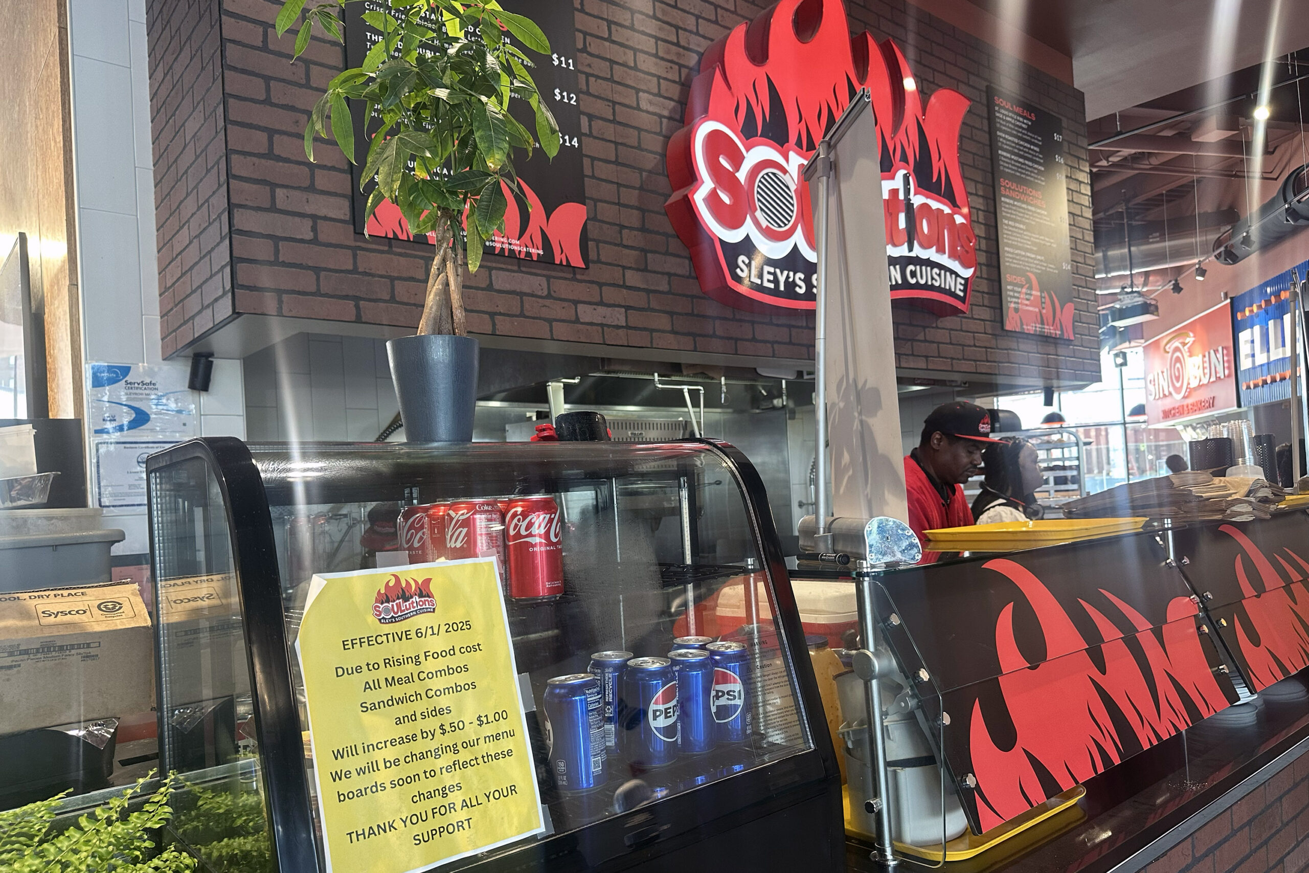 Soulutions restaurant in downtown Syracuse’s Salt City Market posted a flier on June 1 announcing price increases on all meal combos, sandwich combos, and sides.