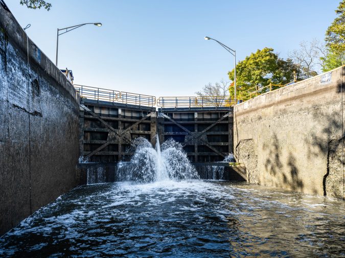 Erie Canal lock filling with water near Pittsford, New York Text