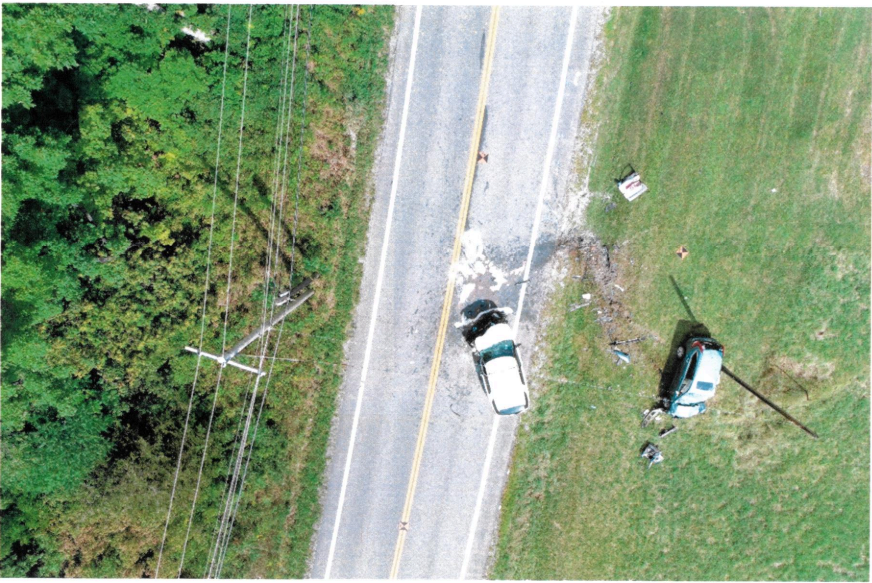 An aerial view of the crash scene in the aftermath of a collision between a Washington County Sheriff's Office deputy and a vehicle driven by Susan Harrington in Argyle, Washington County, in 2019. Harrington's vehicle can be seen on the right.